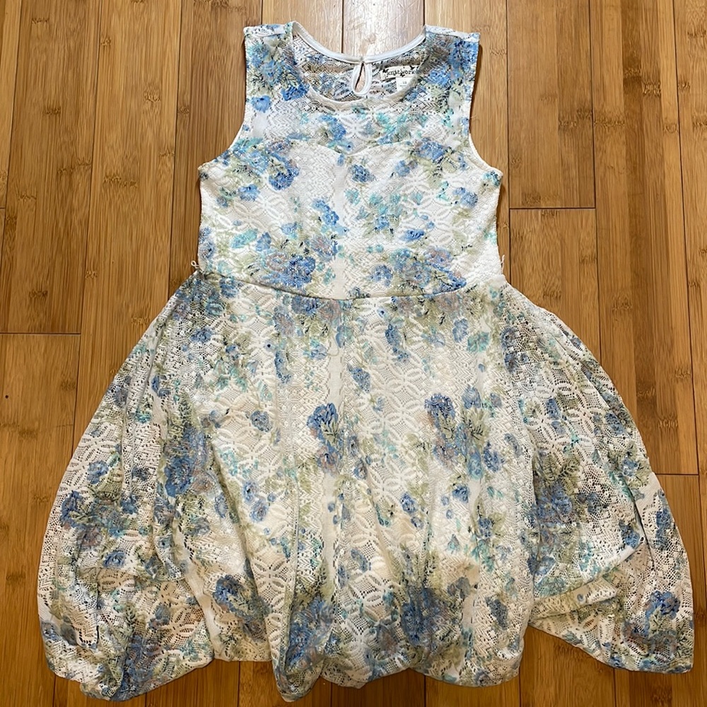 White dress (lace like material) with green and blue floral pattern